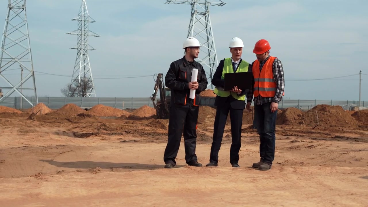 Engineer reviewing technical drawings and specifications at project site