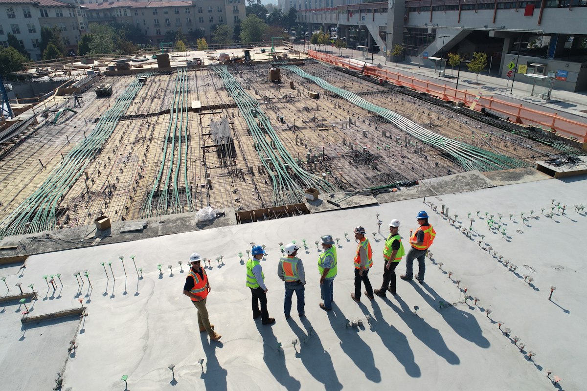 Active construction site with cranes and structure